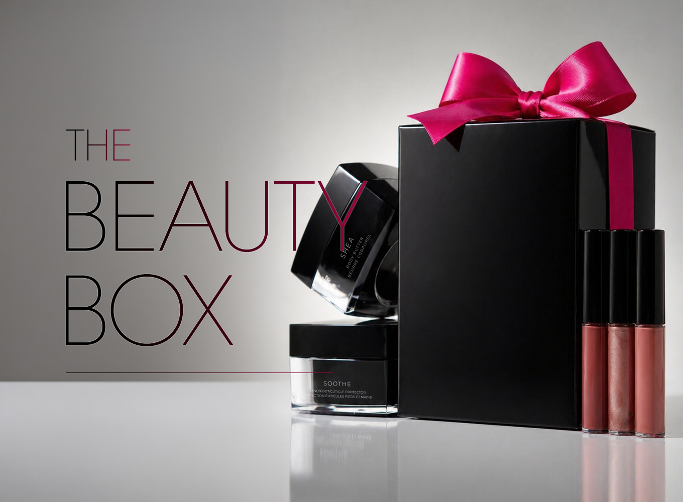 Spring 2026 Beauty Box collection — luxe black gift sets with satin bow featuring Liquid Velvet Lipsticks and body care